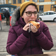 The co-author, Fran Hoepfner, samples an Icelandic hot dog for the first time. (Photo: Cameron Scheetz)